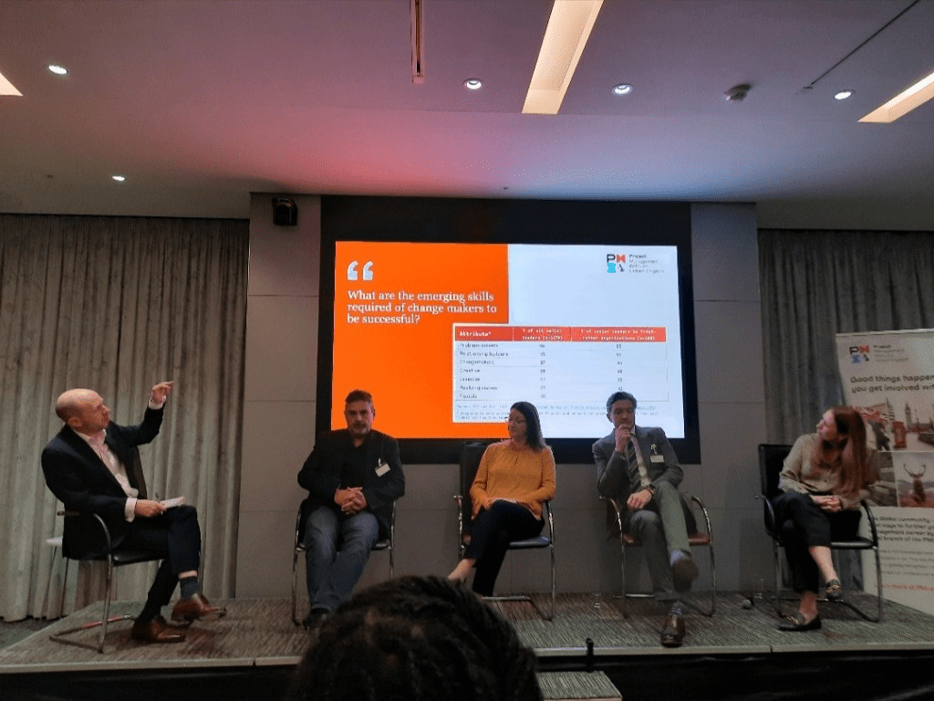 Panellists sitting on the stage